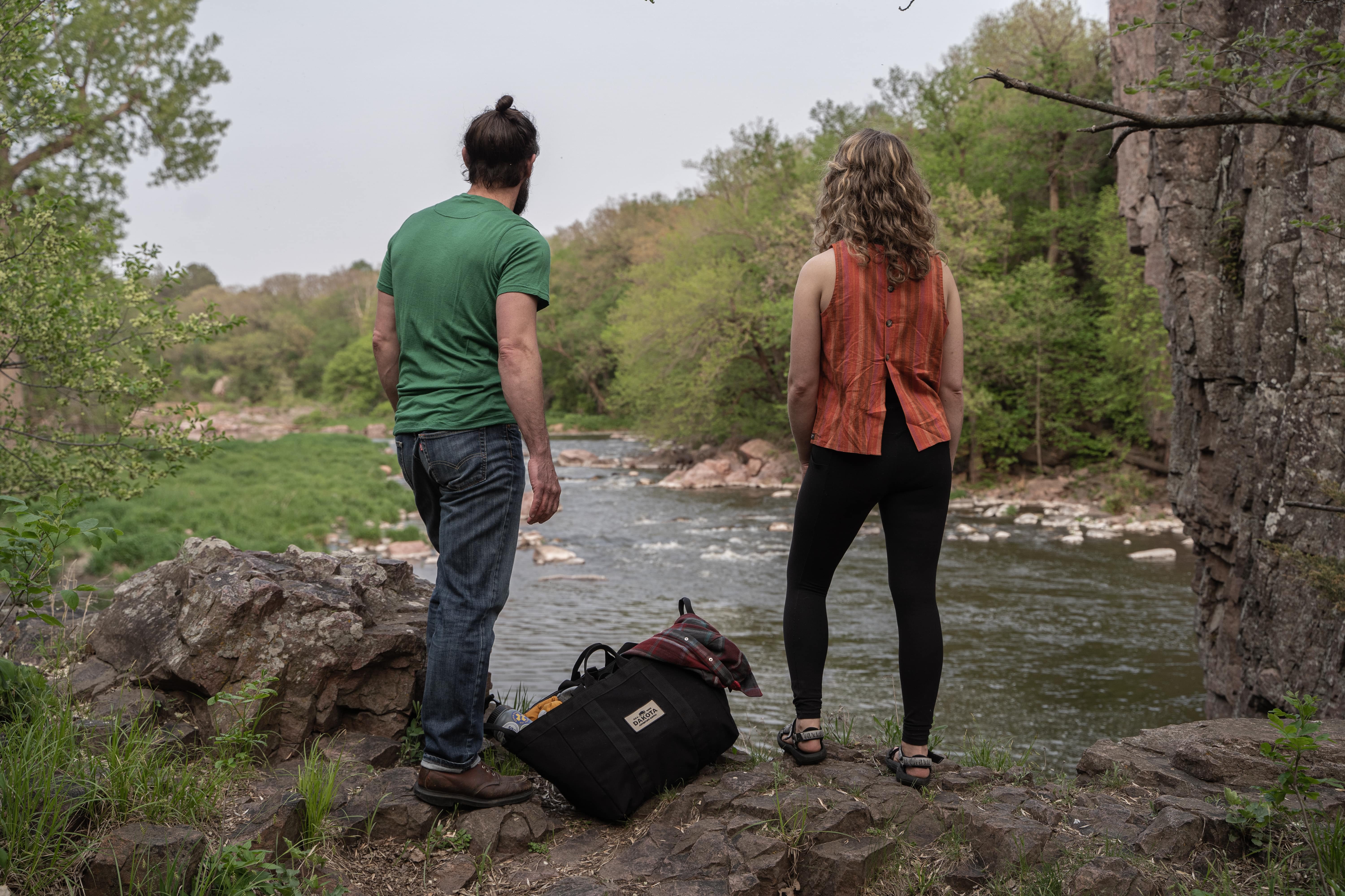 Dakota Adventure Supply gear beside hikers overlooking a South Dakota river