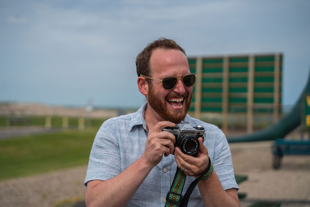 Jeff laughing with a film camera